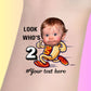 Custom temporary tattoo featuring running hot dog with baby face, text 'Look who's 2', personalized party favor for birthday
