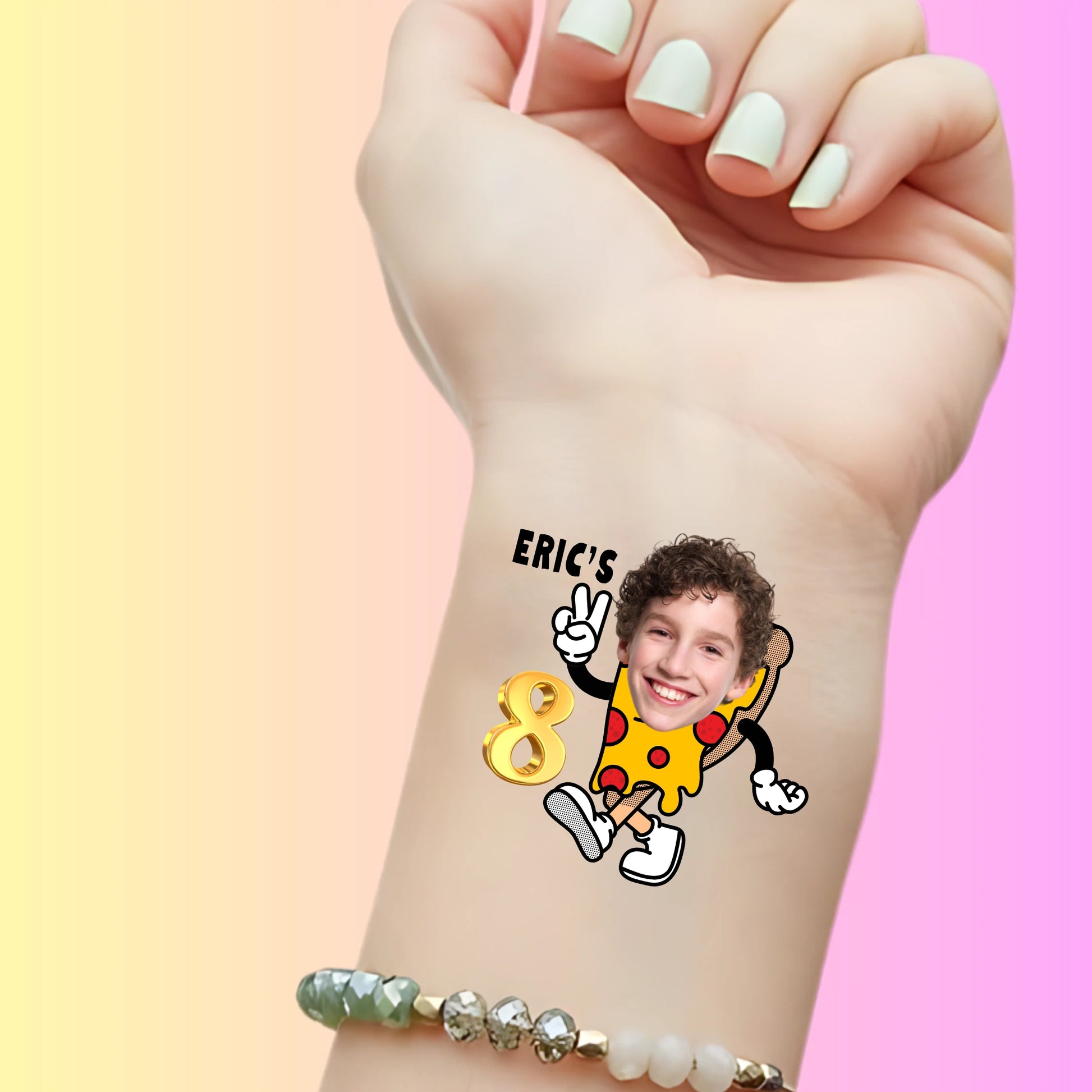 Custom temporary tattoo on wrist with pizza slice character and child's face, celebrating Eric's 8th birthday