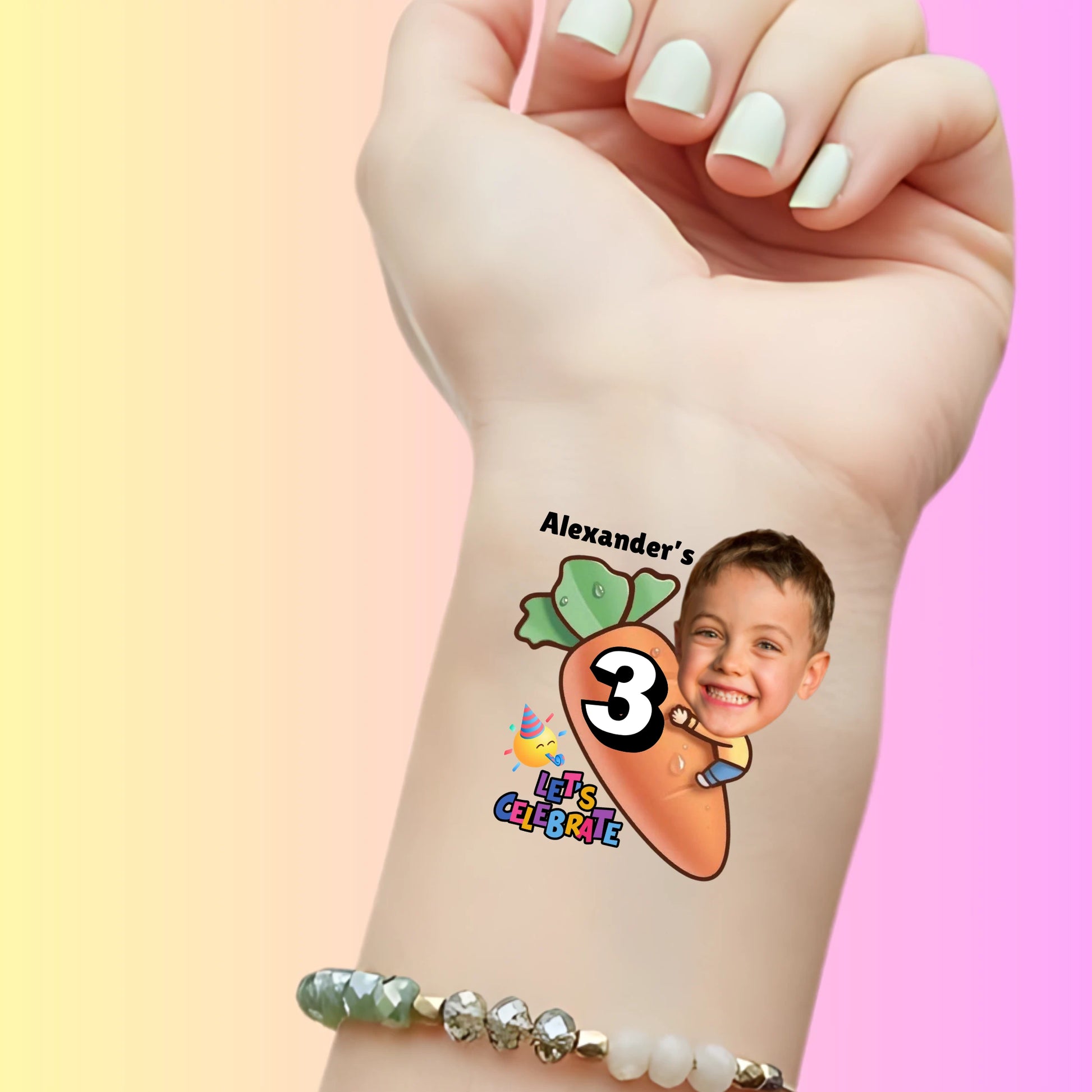 Custom temporary tattoo on wrist showing a carrot with number 3, child's smiling face, and text 'Alexander's Let's Celebrate' for birthday party favor
