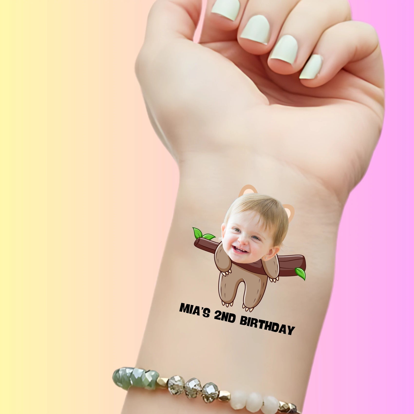 Custom temporary tattoo of toddler face in bear suit with 'Mia's 2nd Birthday' text, personalized party favor