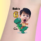 Custom temporary tattoo of a child’s surprised face on a cartoon dinosaur with text Bob's 6 Go! for birthday party favor