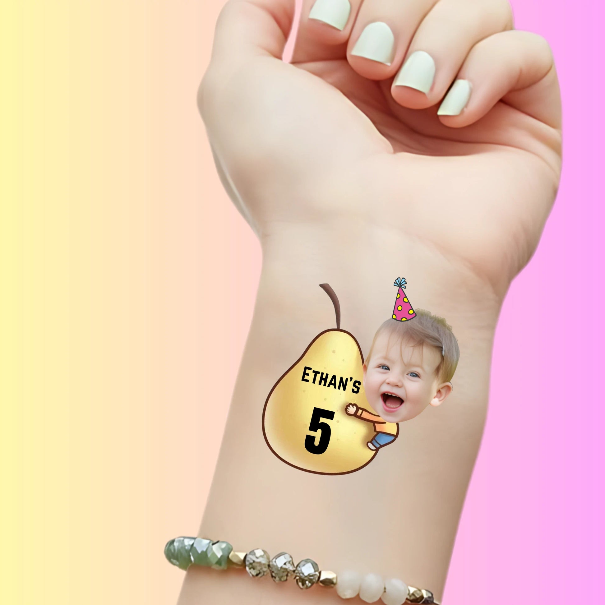Custom temporary tattoo with smiling child face wearing party hat hugging golden pear labeled 'Ethan's 5' for birthday favor