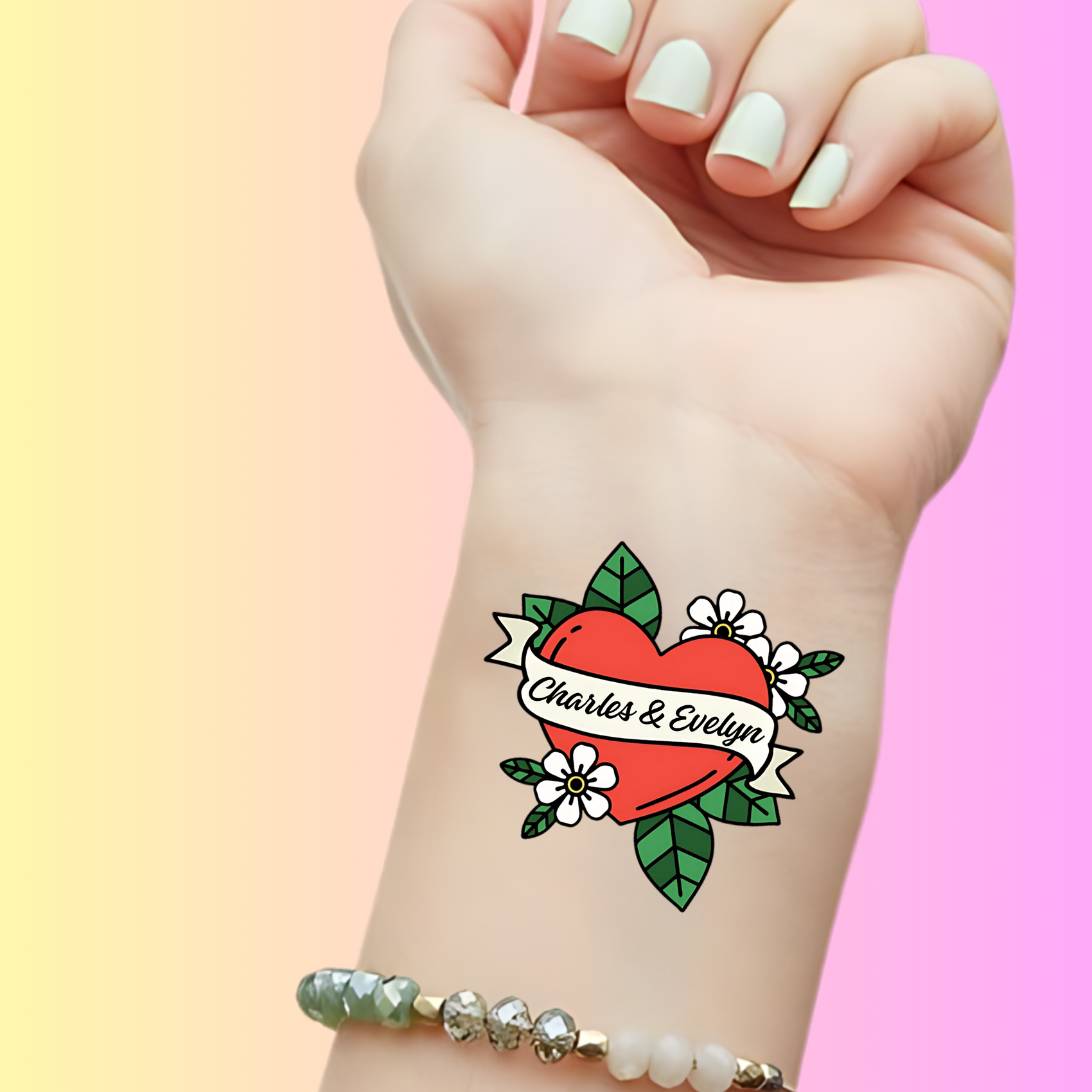 Custom temporary tattoo on wrist with red heart, flowers, leaves, and names Charles & Evelyn, personalized party favor