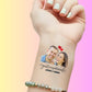 Custom temporary tattoo on wrist with photo of smiling couple, hearts, and text Just Married Jacob & Emma for personalized wedding favor