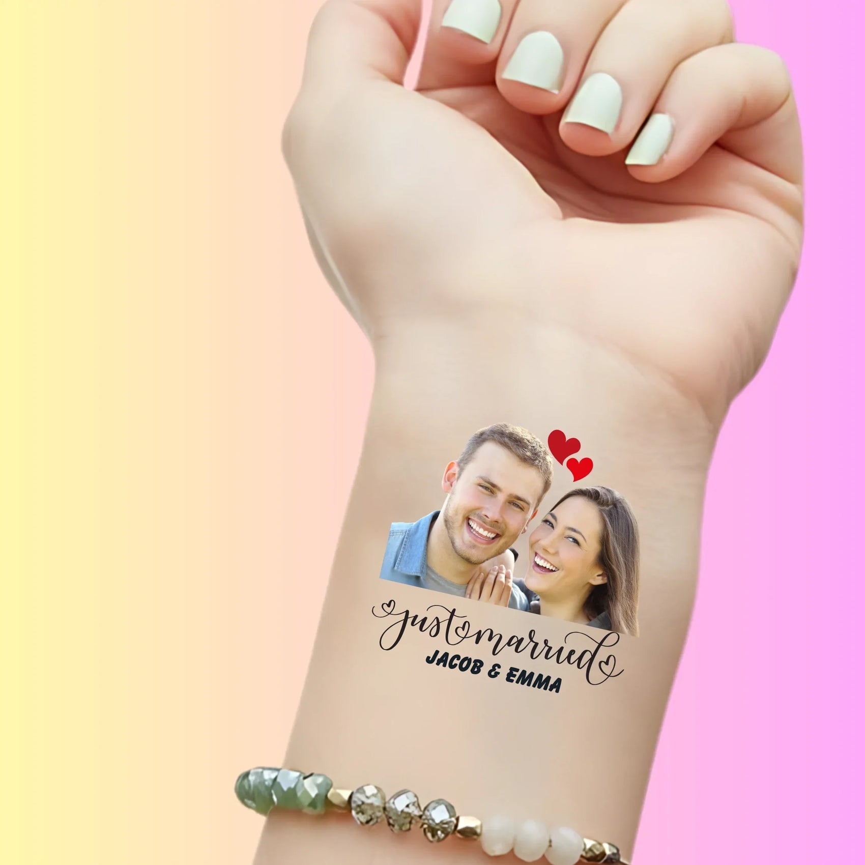 Custom temporary tattoo on wrist with photo of smiling couple, hearts, and text Just Married Jacob & Emma for personalized wedding favor
