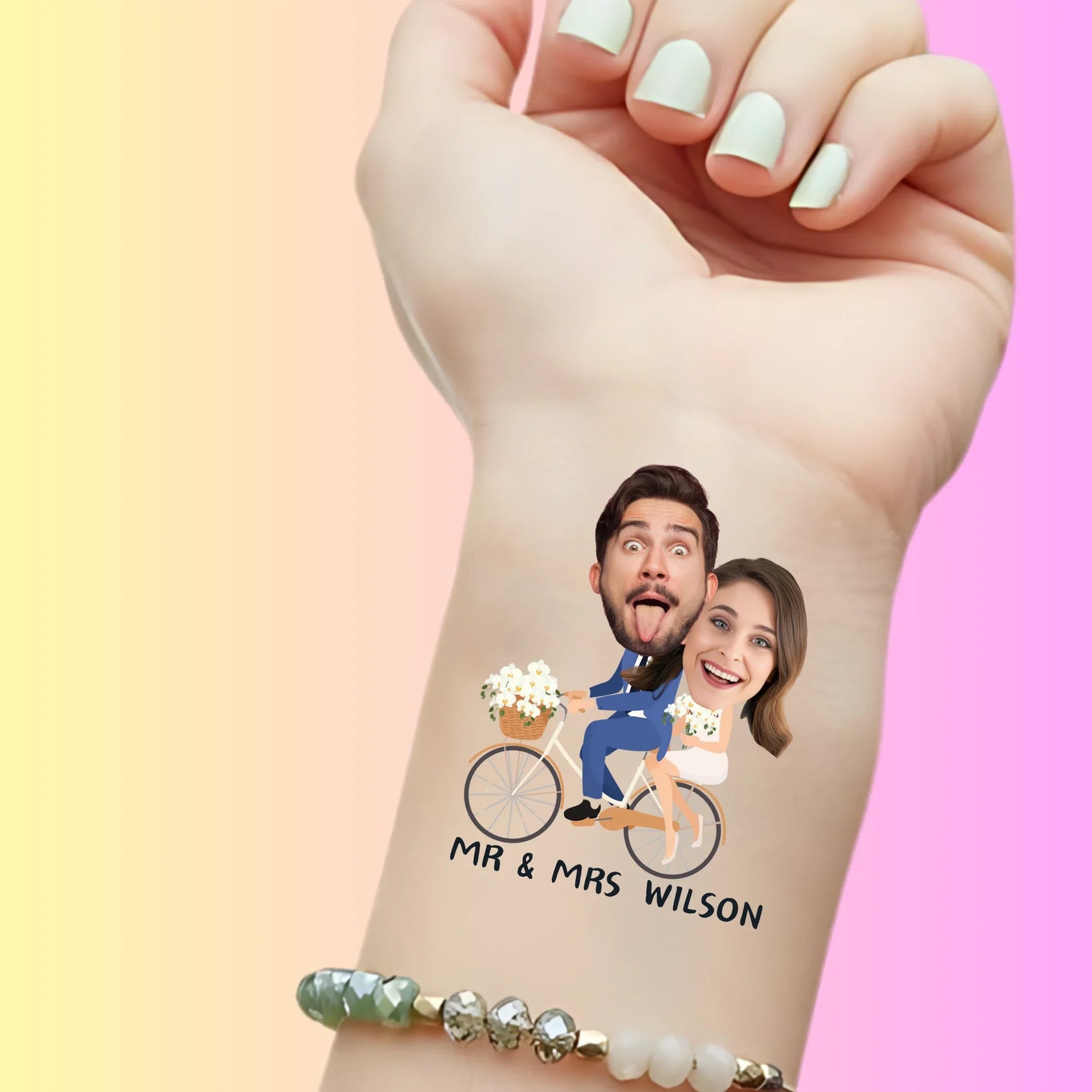 Custom temporary tattoo on wrist showing cartoon bride and groom on bike with faces, personalized party favor for wedding