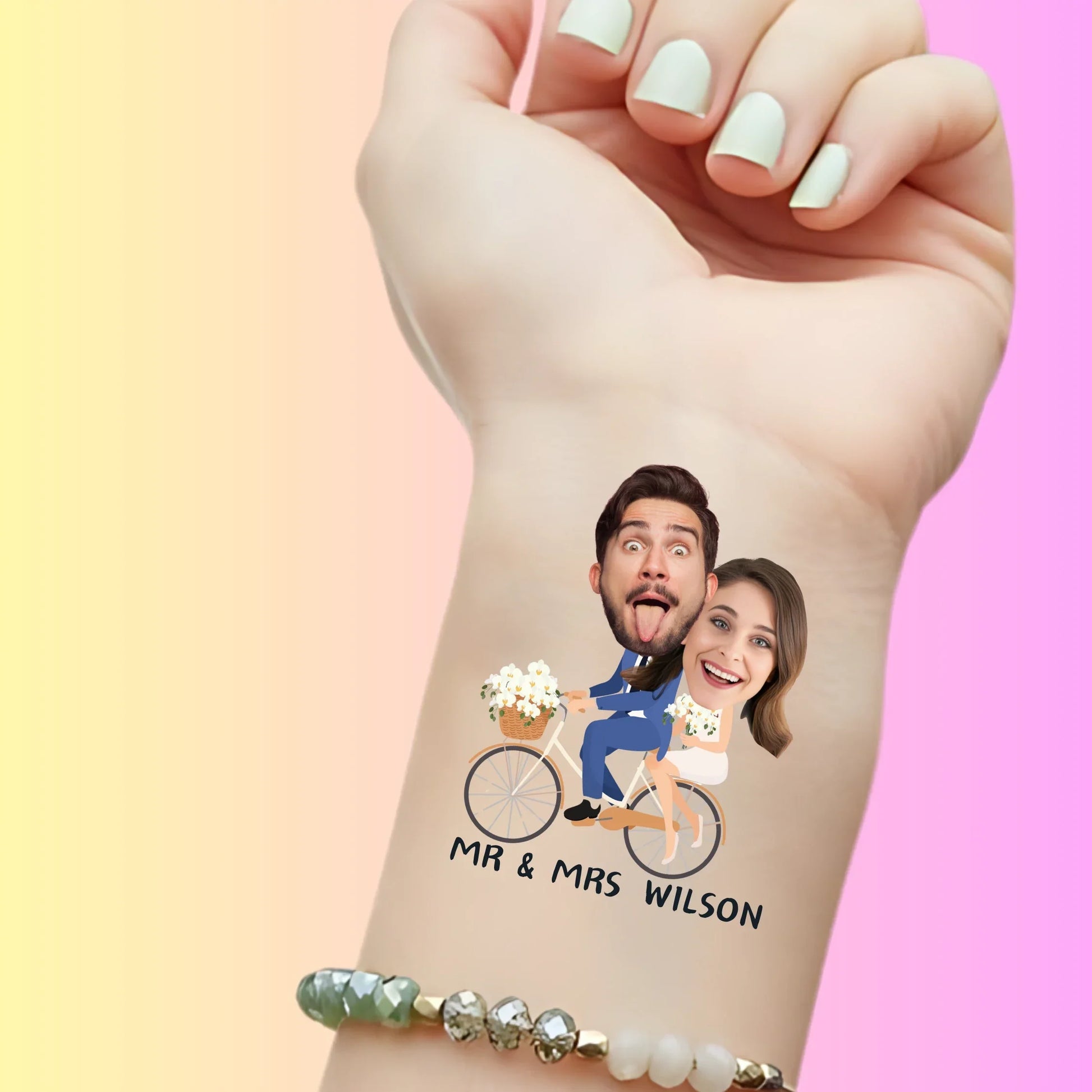 Custom temporary tattoo on wrist showing cartoon bride and groom on bike with faces, personalized party favor for wedding