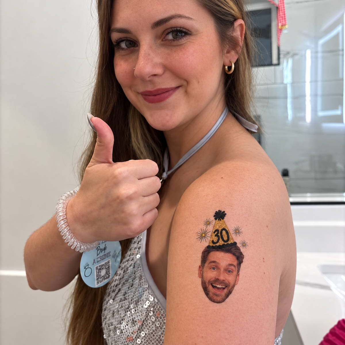 Custom face tattoo with a golden party hat